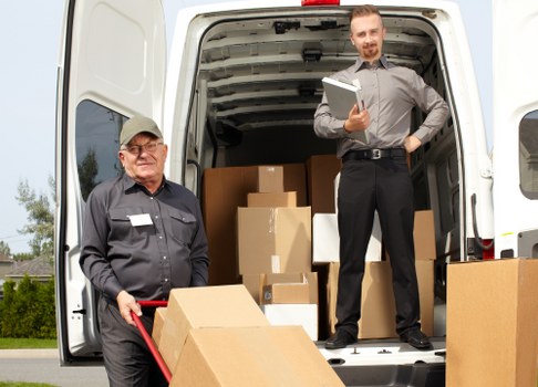 Removal team planning a flat move in Streatham with boxes and furniture