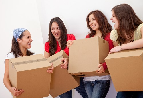Packed moving boxes and furniture prepared for removal in Streatham