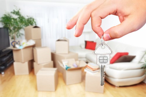 Team using safe lifting techniques during a property move