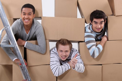 Local movers carrying items through a Streatham residential street