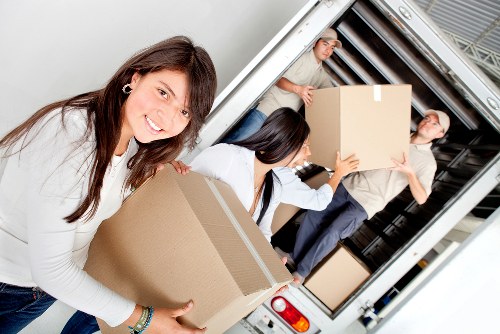 Loading household items into a van for a Streatham move