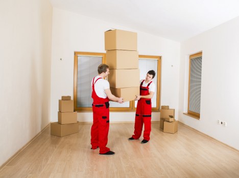 House removal team carrying items from a Streatham property